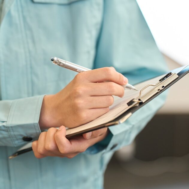 A man in work clothes inspecting a restaurant A man in work clothes inspecting a restaurant
