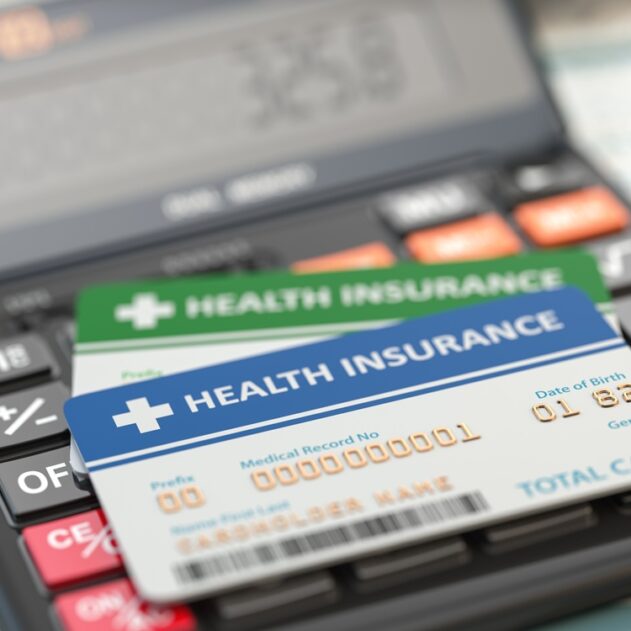 Medical insurance cards on the calculator. Health care costs con Medical insurance cards on the calculator. Health care costs concept. 3d illustration